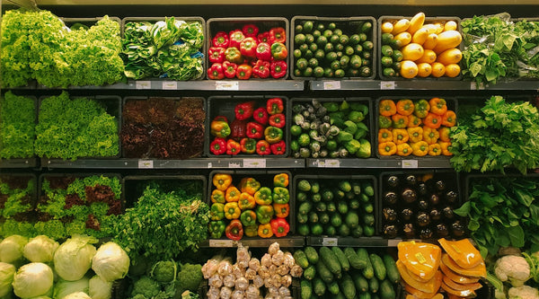 Colourful fruits and vegetables at a market - healthy plant-based eating