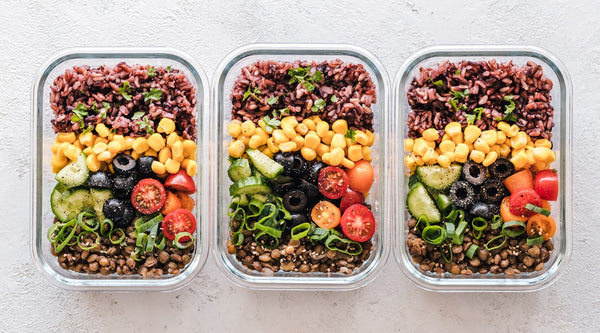 Plant-based meal prep with fruits and vegetables in containers