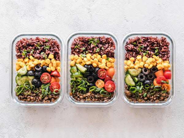Plant-based meal prep with fruits and vegetables in containers