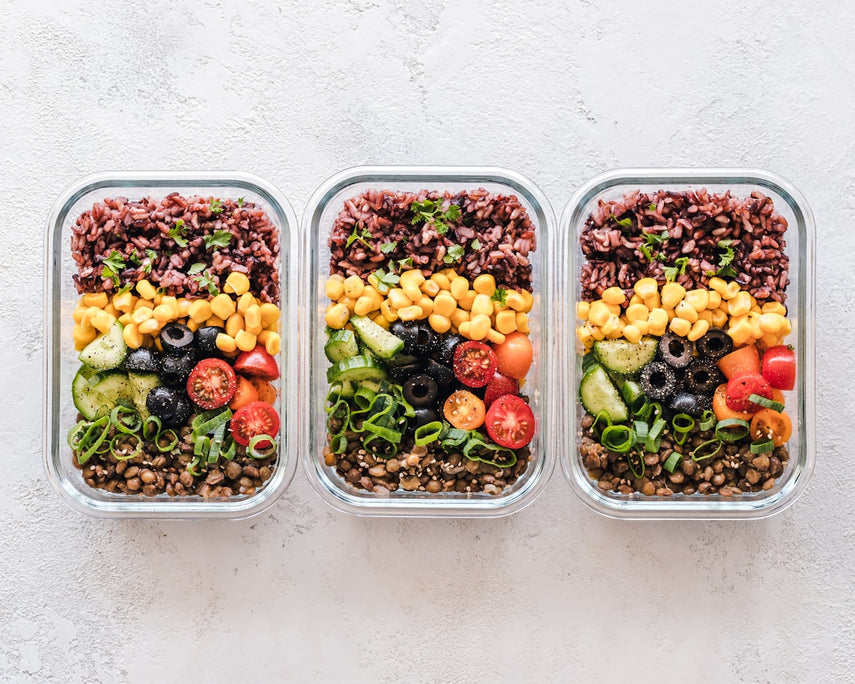 Plant-based meal prep with fruits and vegetables in containers