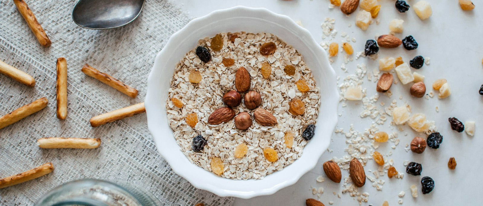 Healthy snacks at a desk including nuts and granola for work
