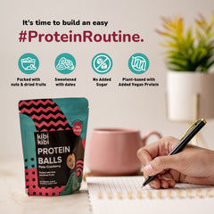 Pista Cranberry protein balls with pencil for size reference