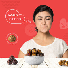 Apple Cinnamon Cheer bliss balls in a bowl showing dates, nuts and apple pieces