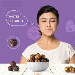 Cocoa Cherry Carnival bliss balls in a bowl showing cocoa solids and cherries
